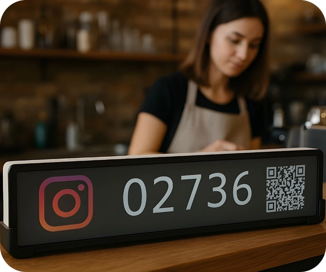 A physical social media counter on a cafe counter.
